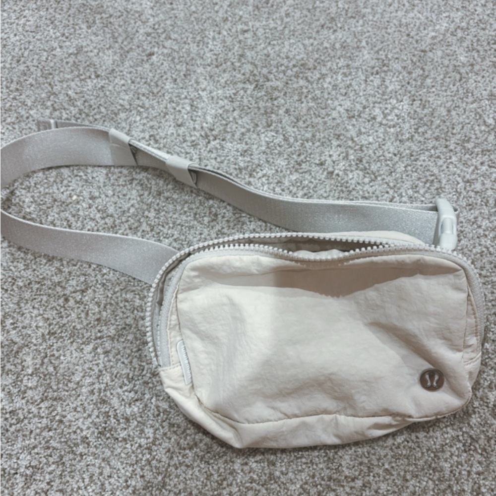 Popular Lululemon Belt Bag in White, Used but Good Condition!